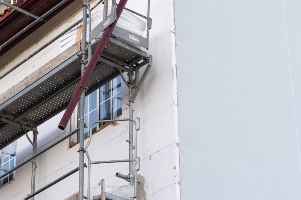 Renovation of the facade of an old building with External thermal insulation cladding